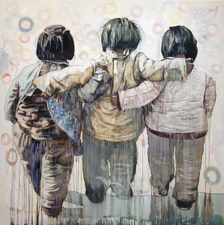 three people hugging
